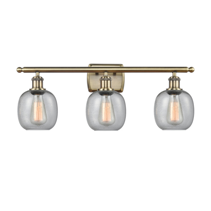 Belfast Bath Vanity Light shown in the Antique Brass finish with a Seedy shade