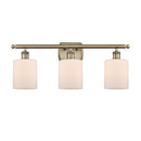 Cobbleskill Bath Vanity Light shown in the Antique Brass finish with a Matte White shade