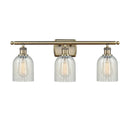 Caledonia Bath Vanity Light shown in the Antique Brass finish with a Mouchette shade