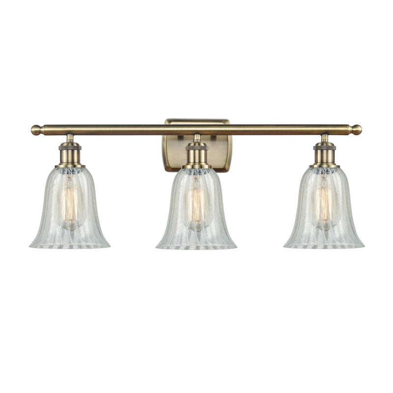 Hanover Bath Vanity Light shown in the Antique Brass finish with a Mouchette shade