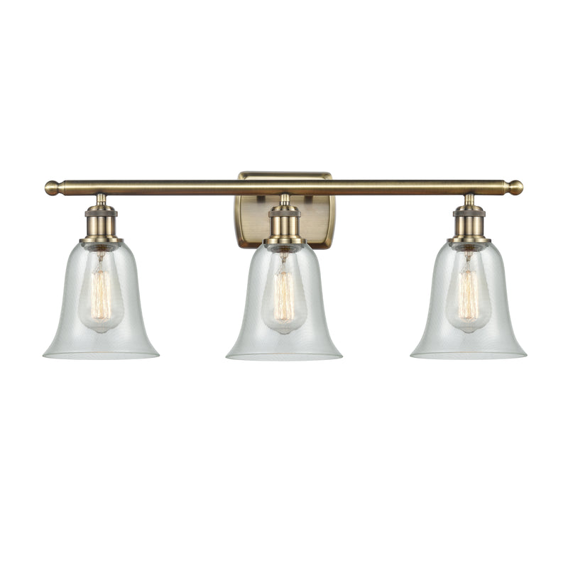 Hanover Bath Vanity Light shown in the Antique Brass finish with a Fishnet shade