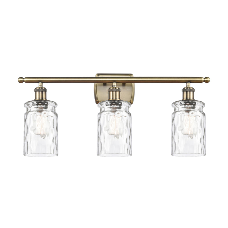 Candor Bath Vanity Light shown in the Antique Brass finish with a Clear Waterglass shade