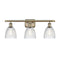 Castile Bath Vanity Light shown in the Antique Brass finish with a Clear shade
