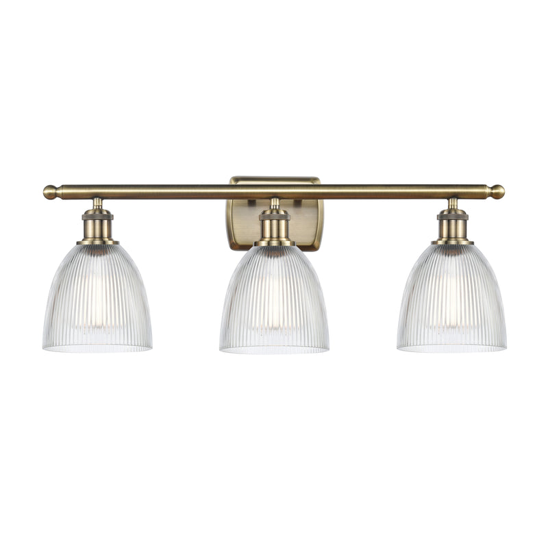 Castile Bath Vanity Light shown in the Antique Brass finish with a Clear shade
