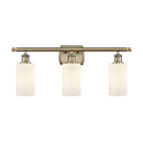 Clymer Bath Vanity Light shown in the Antique Brass finish with a Matte White shade