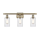 Clymer Bath Vanity Light shown in the Antique Brass finish with a Clear shade