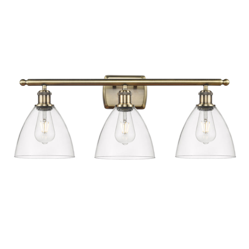 Ballston Dome Bath Vanity Light shown in the Antique Brass finish with a Clear shade