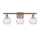 Deco Swirl Bath Vanity Light shown in the Antique Copper finish with a Clear shade