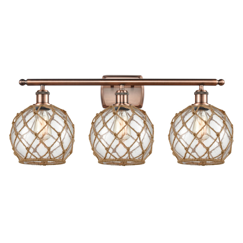 Farmhouse Rope Bath Vanity Light shown in the Antique Copper finish with a Clear Glass with Brown Rope shade