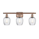 Salina Bath Vanity Light shown in the Antique Copper finish with a Clear Spiral Fluted shade