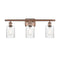 Hadley Bath Vanity Light shown in the Antique Copper finish with a Clear shade