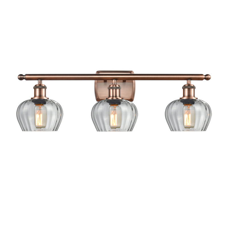 Fenton Bath Vanity Light shown in the Antique Copper finish with a Clear shade