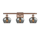Fenton Bath Vanity Light shown in the Antique Copper finish with a Plated Smoke shade