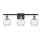 Deco Swirl Bath Vanity Light shown in the Black Antique Brass finish with a Clear shade