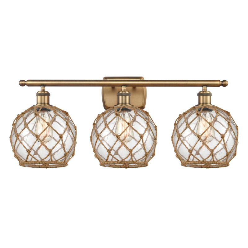 Farmhouse Rope Bath Vanity Light shown in the Brushed Brass finish with a Clear Glass with Brown Rope shade