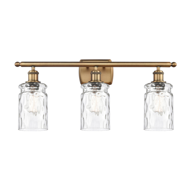 Candor Bath Vanity Light shown in the Brushed Brass finish with a Clear Waterglass shade