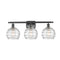 Deco Swirl Bath Vanity Light shown in the Matte Black finish with a Clear shade