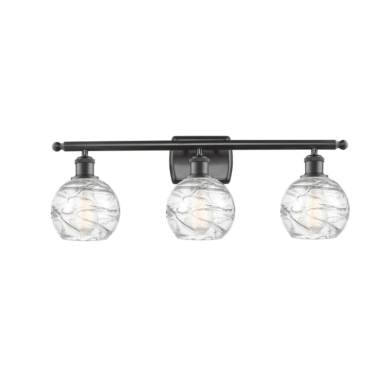 Deco Swirl Bath Vanity Light shown in the Oil Rubbed Bronze finish with a Clear shade