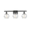 Deco Swirl Bath Vanity Light shown in the Oil Rubbed Bronze finish with a Clear shade