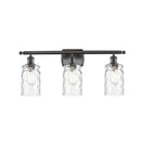 Candor Bath Vanity Light shown in the Oil Rubbed Bronze finish with a Clear Waterglass shade