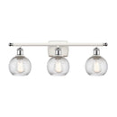 Deco Swirl Bath Vanity Light shown in the White and Polished Chrome finish with a Clear shade