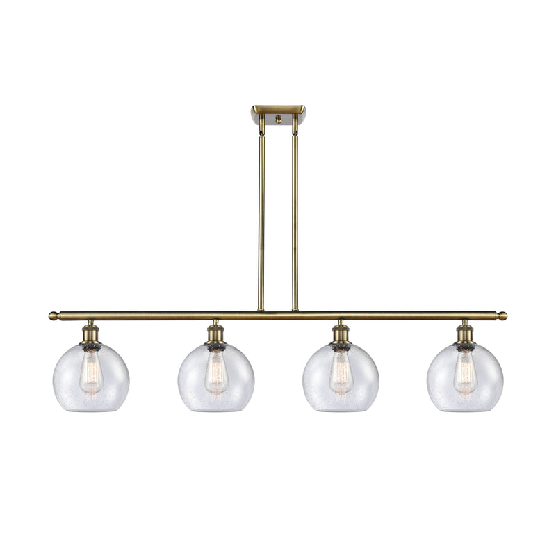 Athens Island Light shown in the Antique Brass finish with a Seedy shade