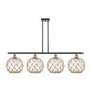 Farmhouse Rope Island Light shown in the Black Antique Brass finish with a Clear Glass with Brown Rope shade