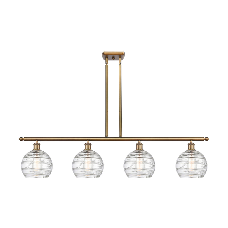 Deco Swirl Island Light shown in the Brushed Brass finish with a Clear shade