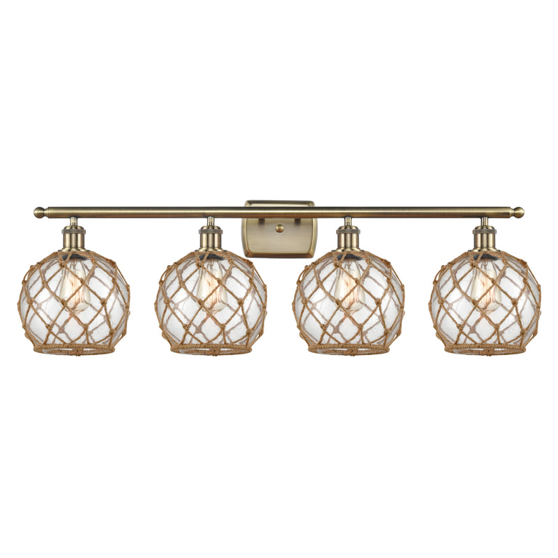 Farmhouse Rope Bath Vanity Light shown in the Antique Brass finish with a Clear Glass with Brown Rope shade