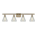 Conesus Bath Vanity Light shown in the Antique Brass finish with a Clear Crackle shade