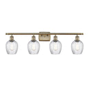 Salina Bath Vanity Light shown in the Antique Brass finish with a Clear Spiral Fluted shade