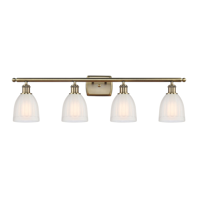 Brookfield Bath Vanity Light shown in the Antique Brass finish with a White shade