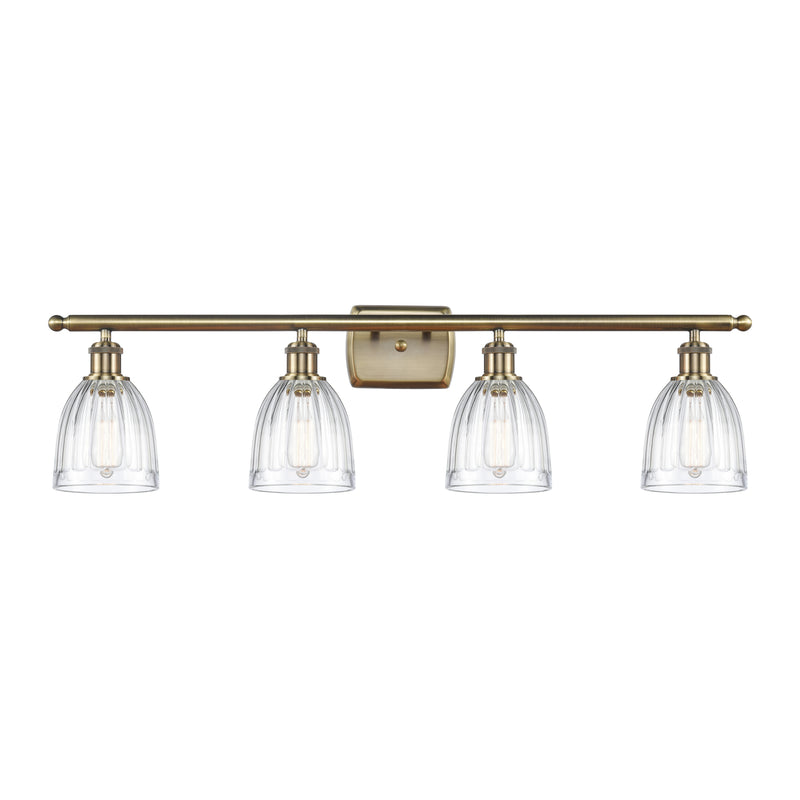 Brookfield Bath Vanity Light shown in the Antique Brass finish with a Clear shade