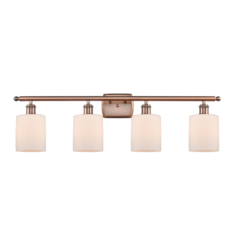 Cobbleskill Bath Vanity Light shown in the Antique Copper finish with a Matte White shade