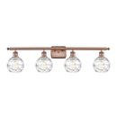 Deco Swirl Bath Vanity Light shown in the Antique Copper finish with a Clear shade