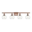 Athens Bath Vanity Light shown in the Antique Copper finish with a Clear shade
