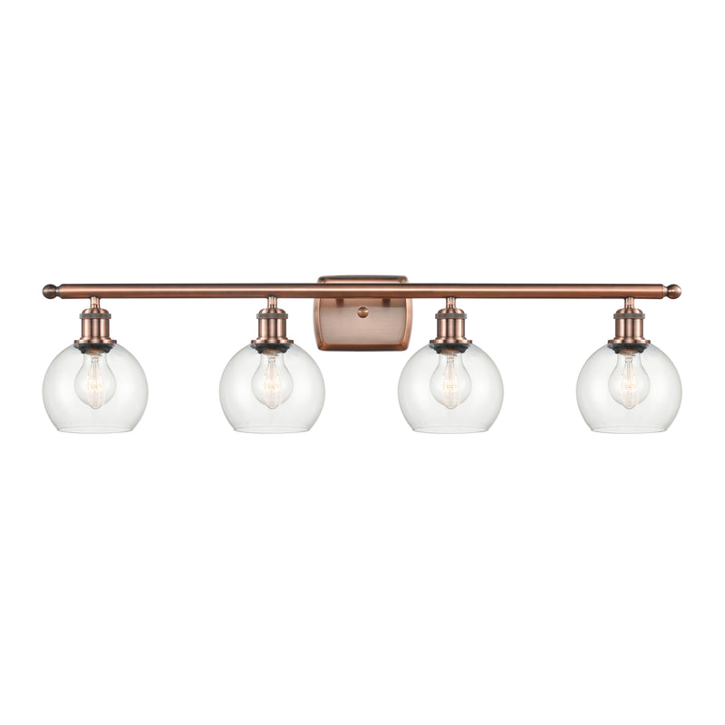 Athens Bath Vanity Light shown in the Antique Copper finish with a Clear shade