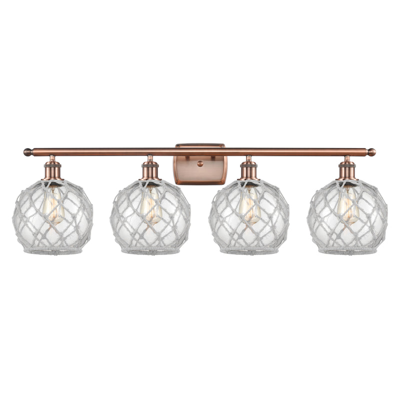 Farmhouse Rope Bath Vanity Light shown in the Antique Copper finish with a Clear Glass with White Rope shade