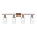 Candor Bath Vanity Light shown in the Antique Copper finish with a Clear Waterglass shade