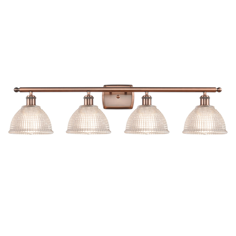 Arietta Bath Vanity Light shown in the Antique Copper finish with a Clear shade