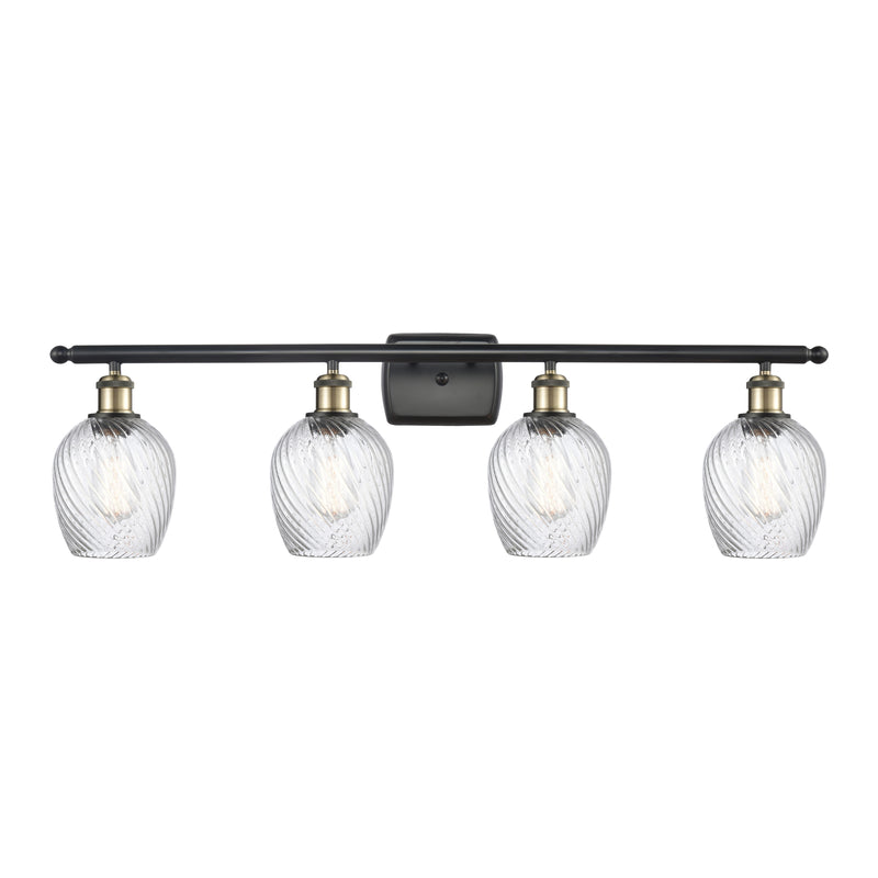 Salina Bath Vanity Light shown in the Black Antique Brass finish with a Clear Spiral Fluted shade