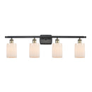 Hadley Bath Vanity Light shown in the Black Antique Brass finish with a Matte White shade