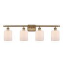 Cobbleskill Bath Vanity Light shown in the Brushed Brass finish with a Matte White shade