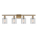 Cobbleskill Bath Vanity Light shown in the Brushed Brass finish with a Clear shade