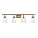 Hadley Bath Vanity Light shown in the Brushed Brass finish with a Clear shade