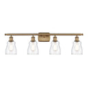 Ellery Bath Vanity Light shown in the Brushed Brass finish with a Clear shade