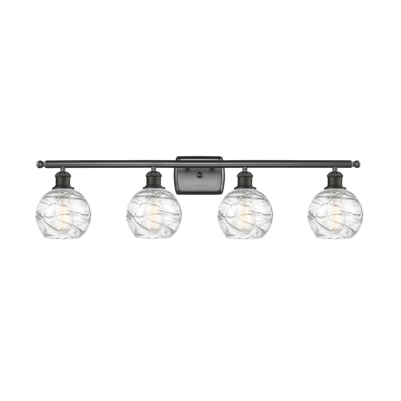 Deco Swirl Bath Vanity Light shown in the Oil Rubbed Bronze finish with a Clear shade