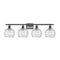 Deco Swirl Bath Vanity Light shown in the Oil Rubbed Bronze finish with a Clear shade