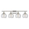 Deco Swirl Bath Vanity Light shown in the Polished Nickel finish with a Clear shade