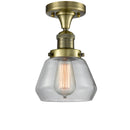 Fulton Semi-Flush Mount shown in the Antique Brass finish with a Clear shade